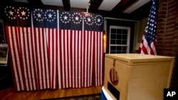 FILE - A ballot box is set for residents to vote in Dixville Notch, New Hampshire, Nov. 7, 2016. A request for detailed information about every voter in the U.S. from President Donald Trump's voting commission is getting a rocky reception in some states.